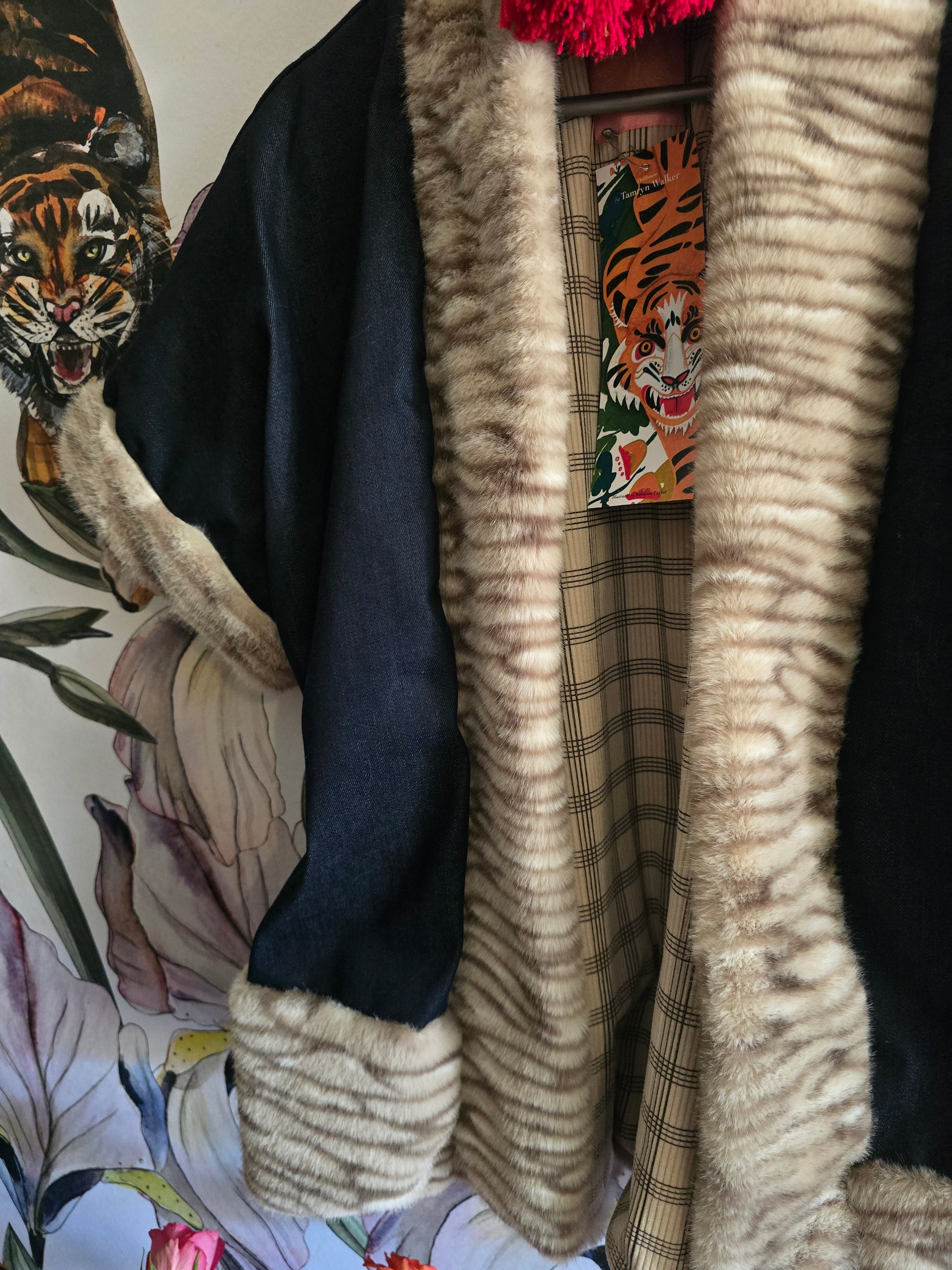 The DENIM & FAUX FUR REVERSIBLE BOLERO WITH CHECK LINING.