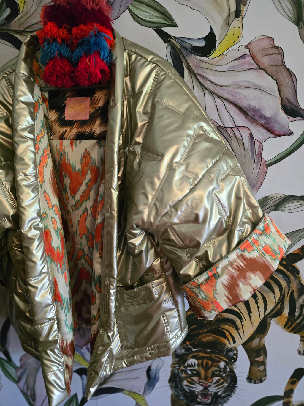 The COOL MOM REVERSIBLE PUFFER IN PEWTER & IKAT ( ONLY ONE )