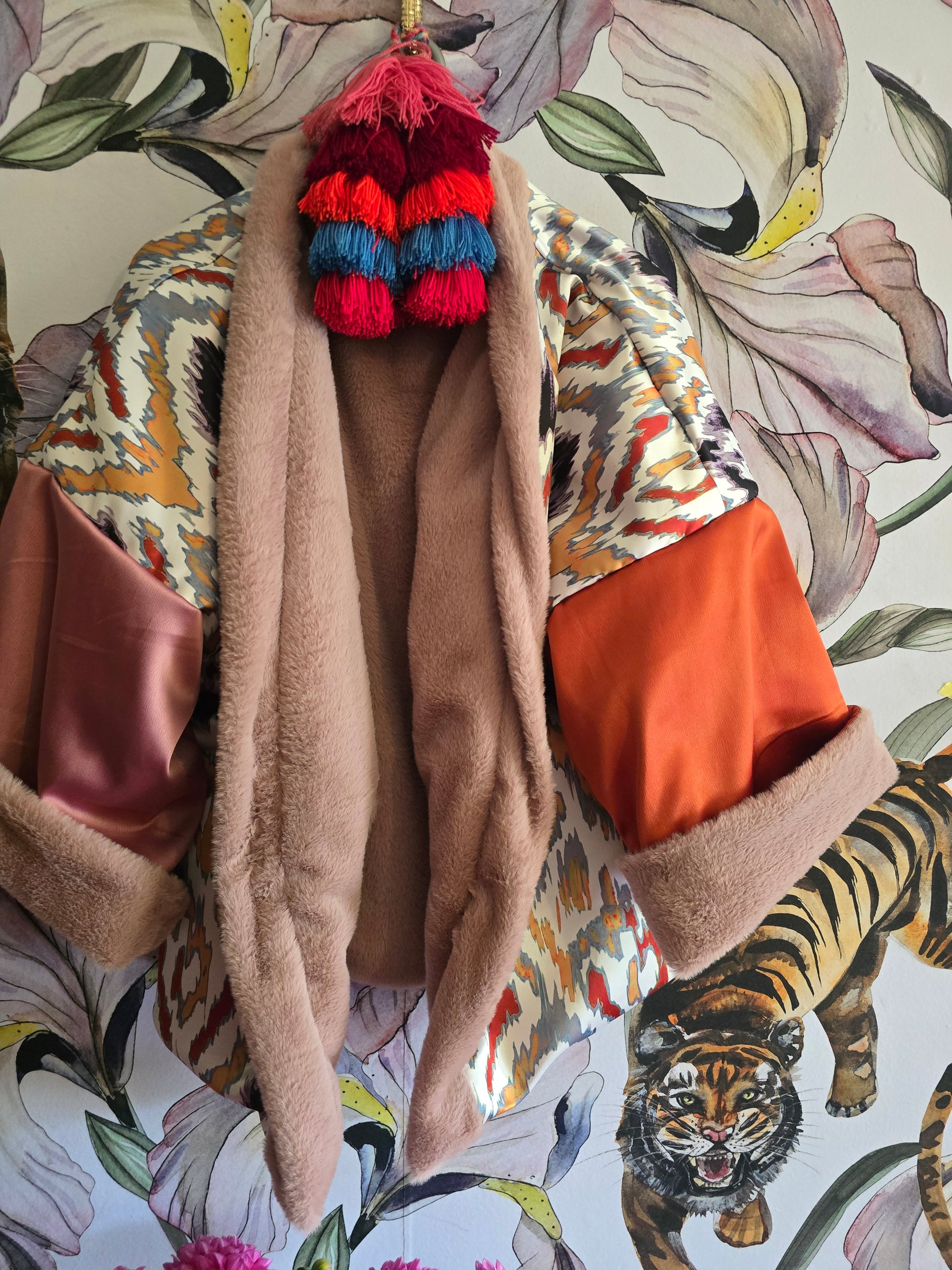 The BLUSHING BABE REVERSIBLE FAUX FUR BOMBER WITH IKAT