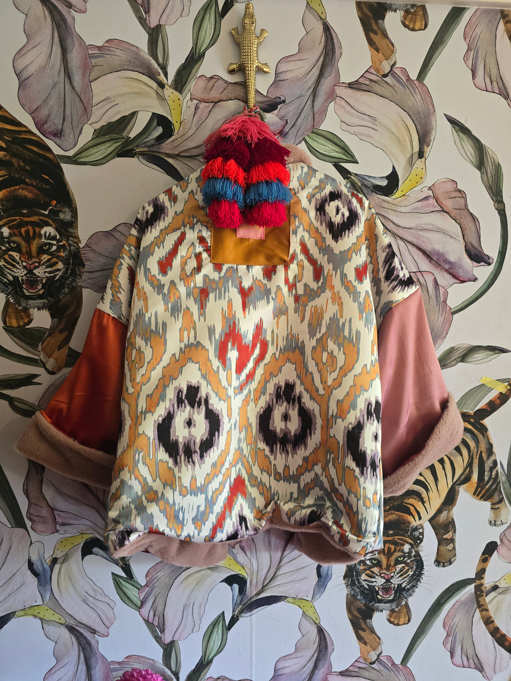 The BLUSHING BABE REVERSIBLE FAUX FUR BOMBER WITH IKAT