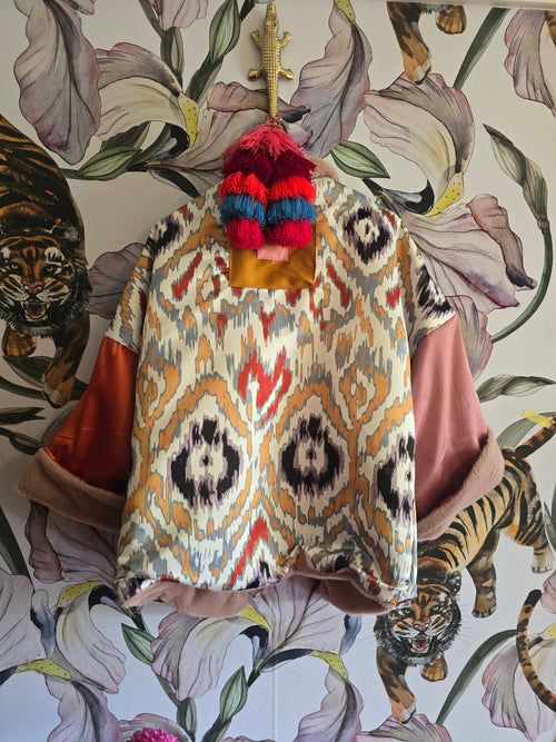 The BLUSHING BABE REVERSIBLE FAUX FUR BOMBER WITH IKAT