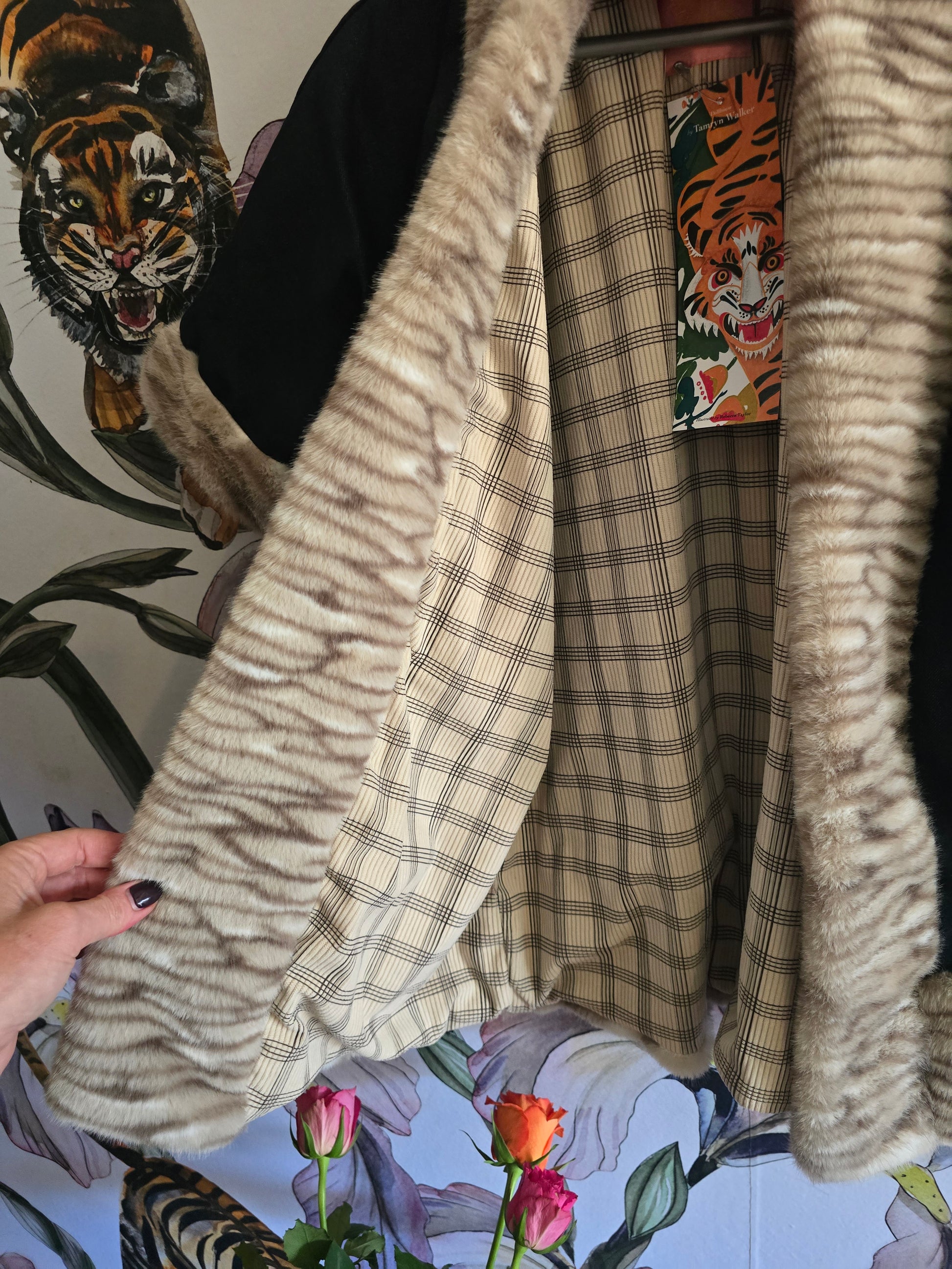 The DENIM & FAUX FUR REVERSIBLE BOLERO WITH CHECK LINING.