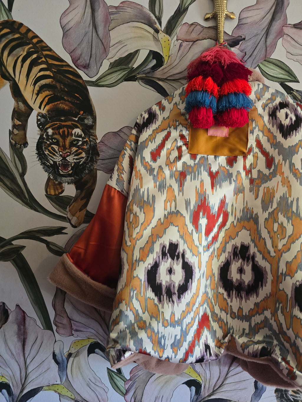 The BLUSHING BABE REVERSIBLE FAUX FUR BOMBER WITH IKAT