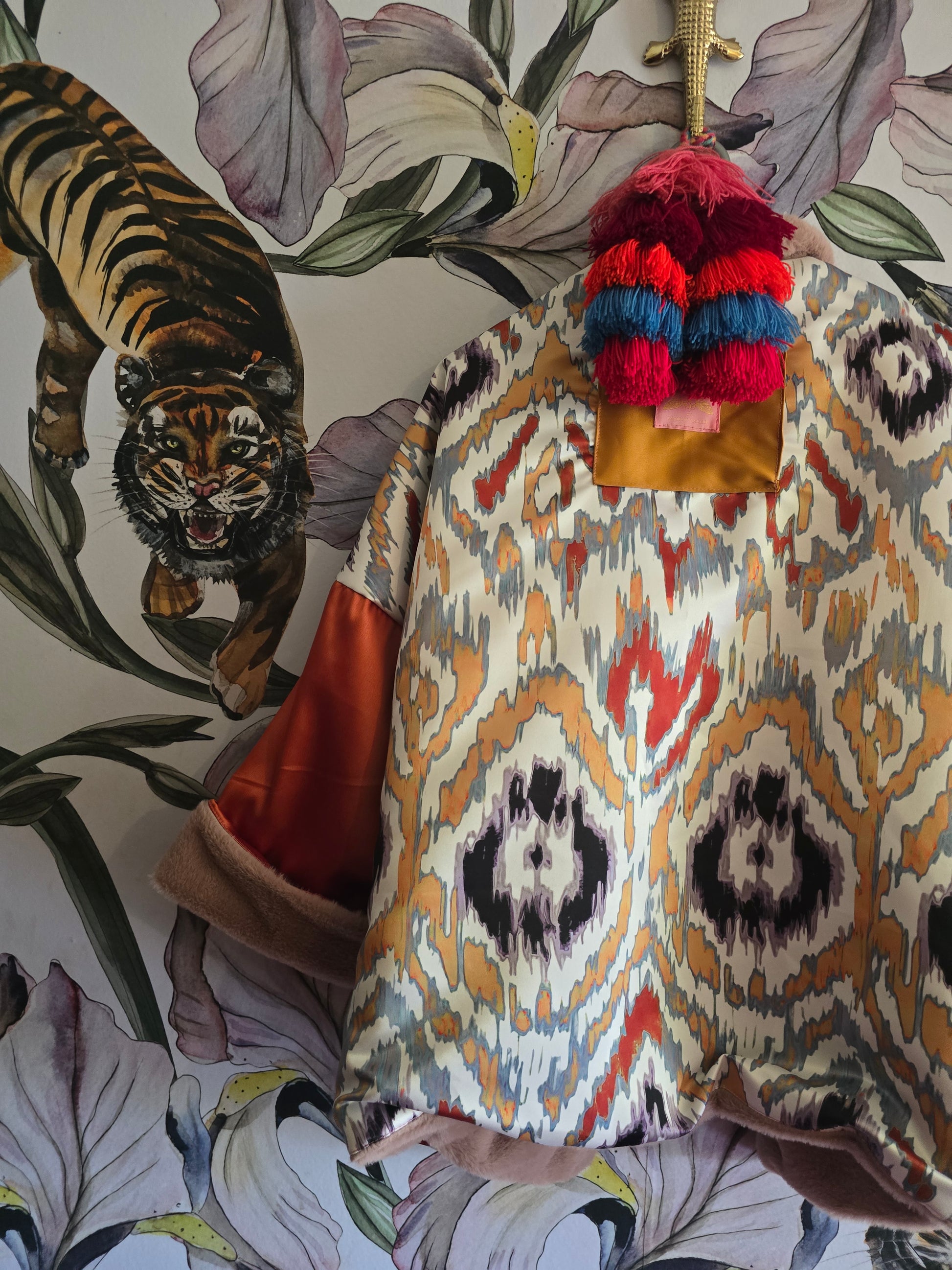 The BLUSHING BABE REVERSIBLE FAUX FUR BOMBER WITH IKAT