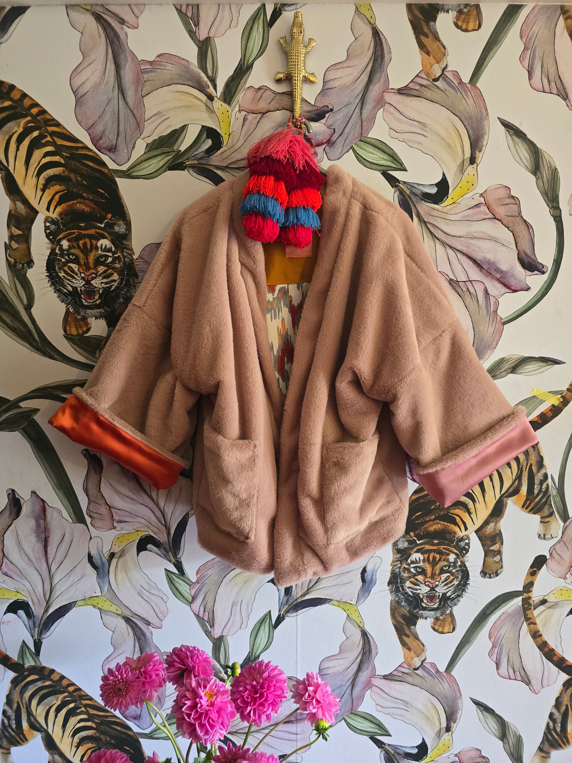 The BLUSHING BABE REVERSIBLE FAUX FUR BOMBER WITH IKAT