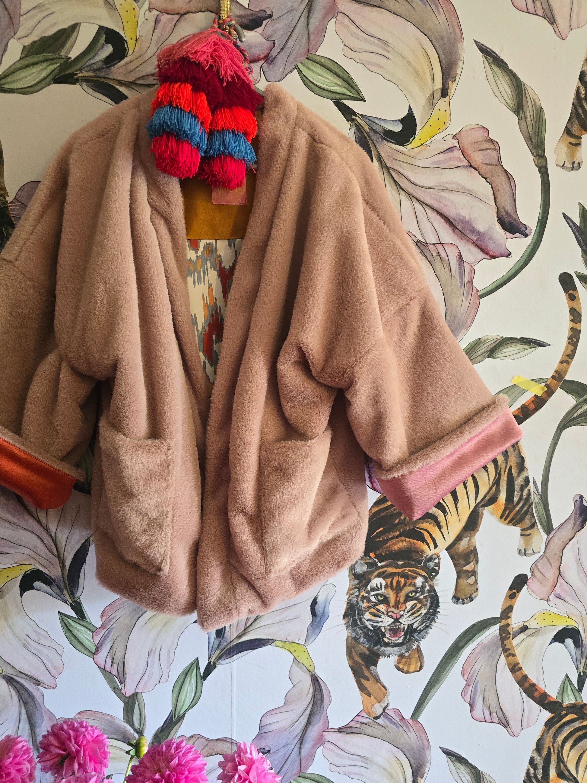 The BLUSHING BABE REVERSIBLE FAUX FUR BOMBER WITH IKAT