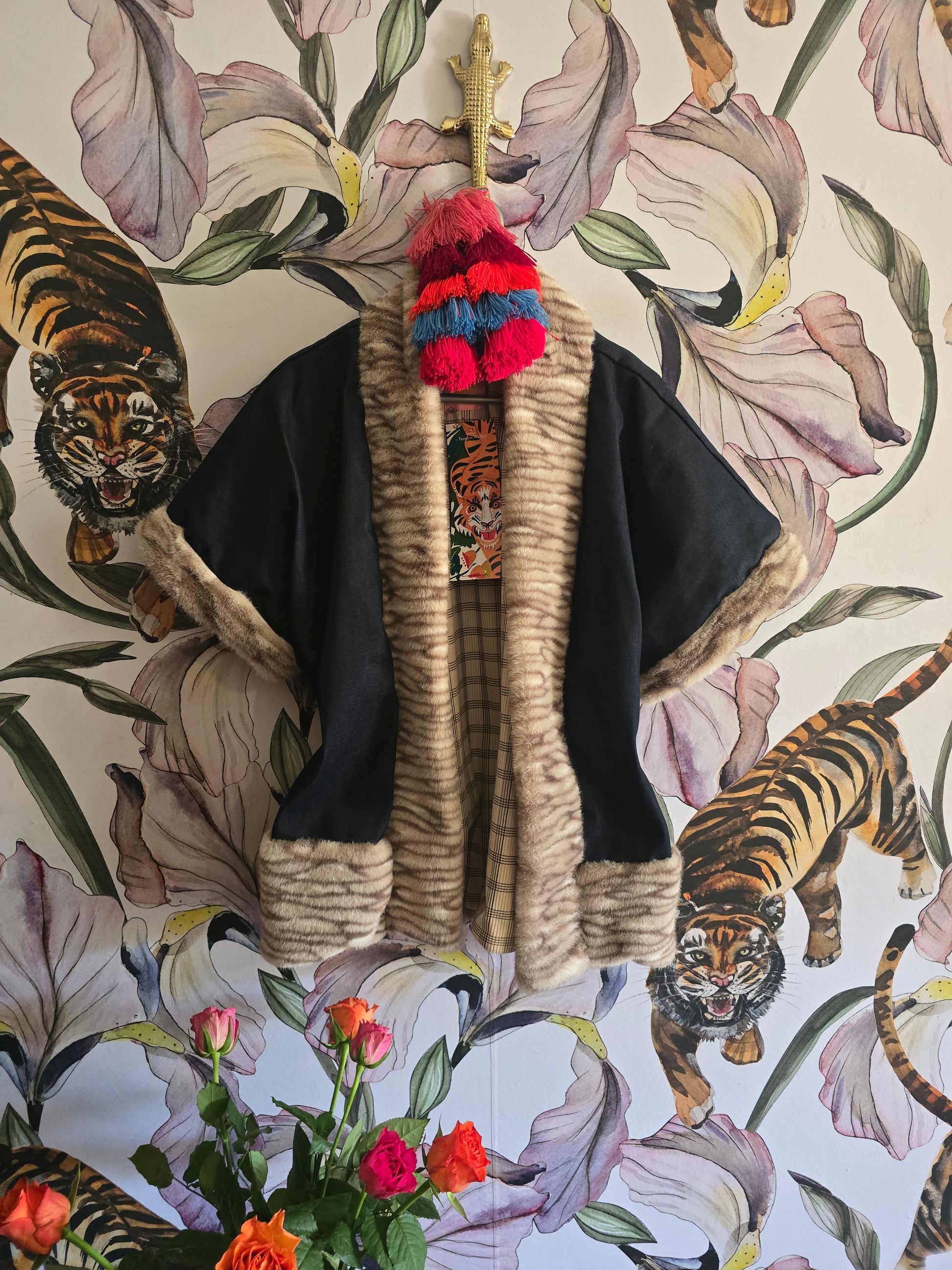 The DENIM & FAUX FUR REVERSIBLE BOLERO WITH CHECK LINING.