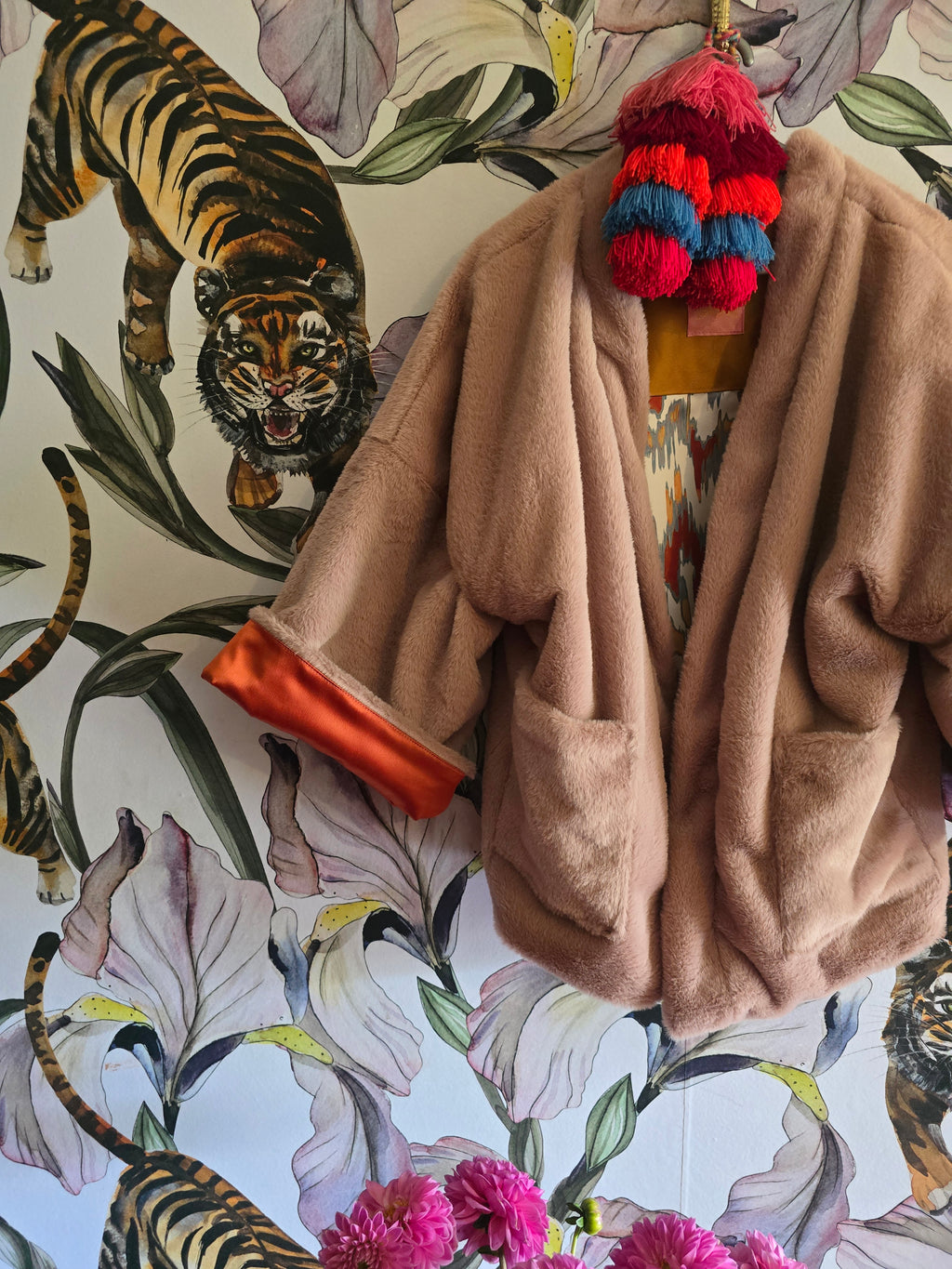 The BLUSHING BABE REVERSIBLE FAUX FUR BOMBER WITH IKAT