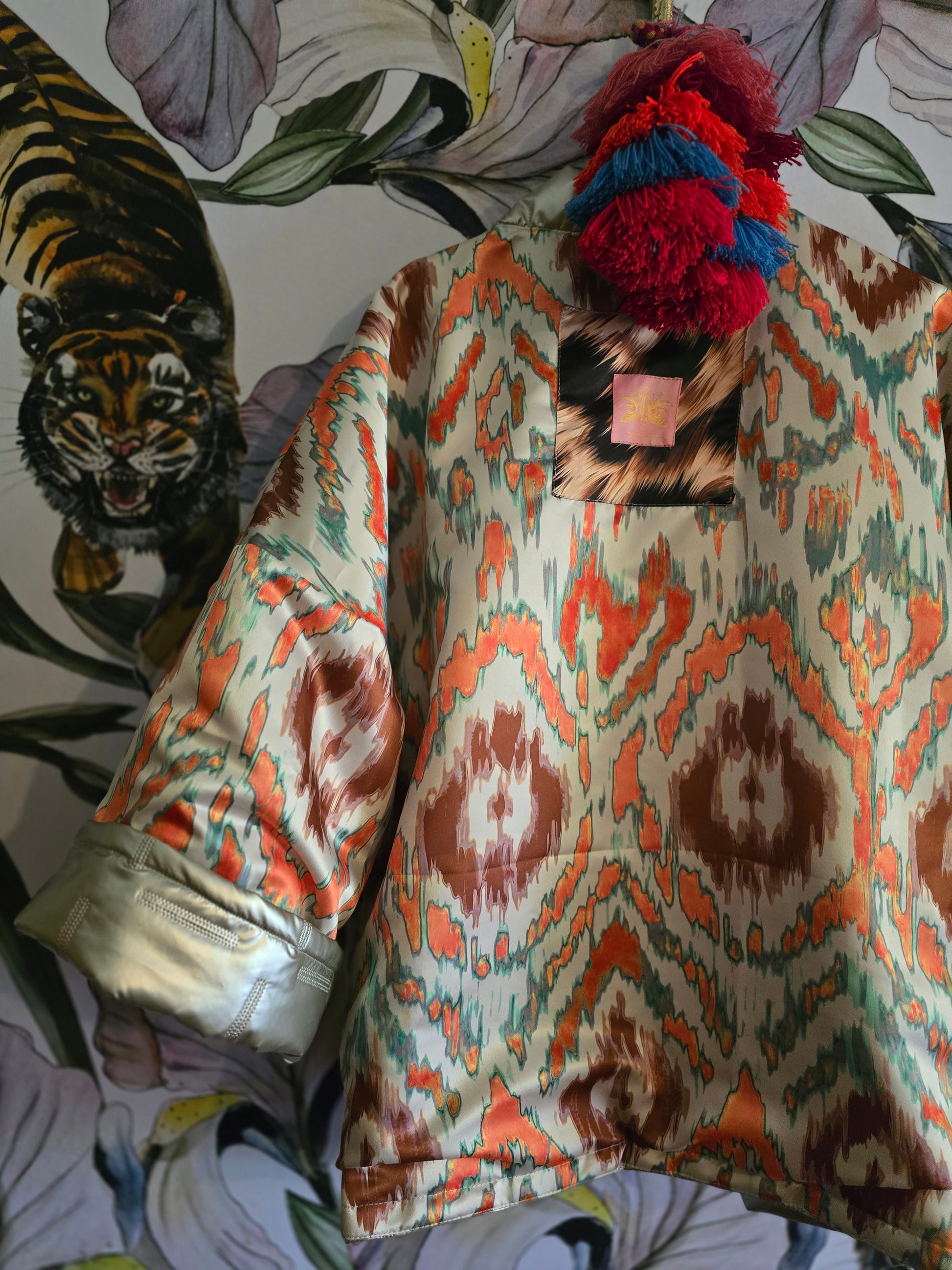 The COOL MOM REVERSIBLE PUFFER IN PEWTER & IKAT ( ONLY ONE )