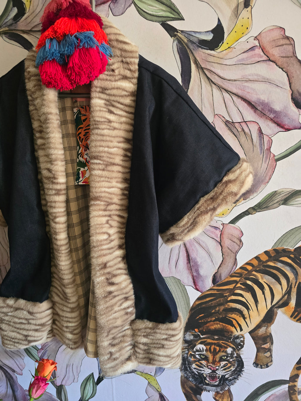 The DENIM & FAUX FUR REVERSIBLE BOLERO WITH CHECK LINING.